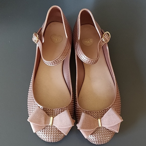 Melissa Shoes - Mel by Melissa metallic pink bow flats.